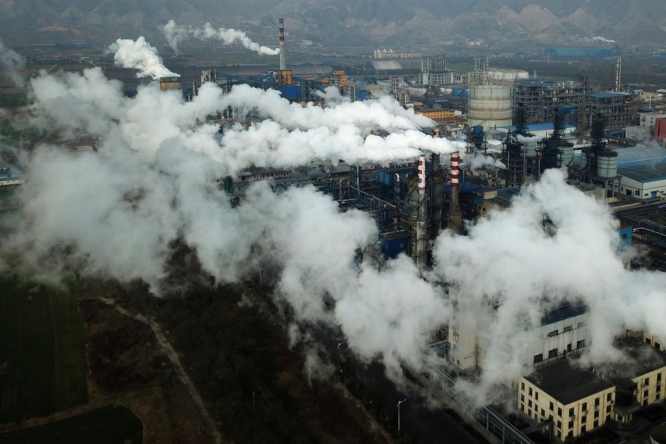 Smoke and steam rise from a coal processing plant in Hejin, in central China's Shanxi Province.