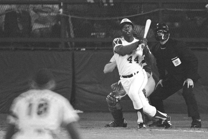 Atlanta Braves' Hank Aaron eyes the flight of the ball after hitting his 715th career homer in a game against the Los Angeles Dodgers in Atlanta, Ga., in this April 8, 1974 file photo. (AP Photo/Harry Harrris, File)