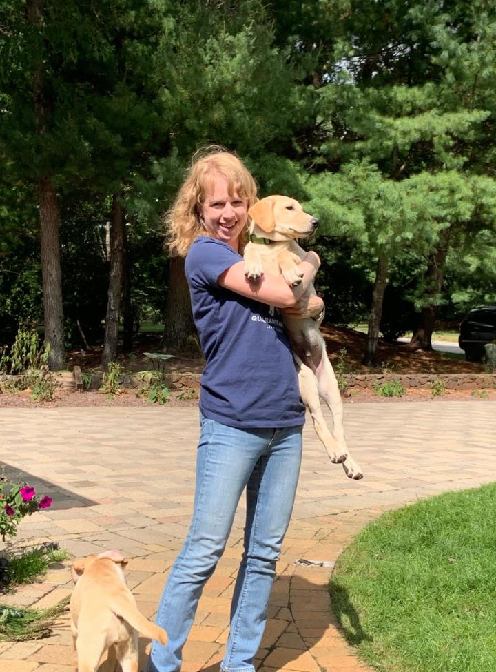 The author, picking up Beau, then three-and-a-half months old, at his foster home last September.