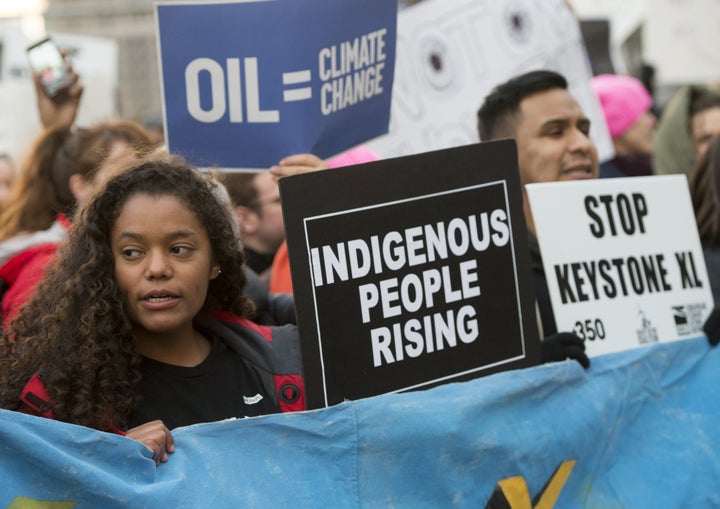 Opponents of the Keystone XL and Dakota Access pipelines protest President Trump's executive orders advancing their construction, at a rally in Lafayette Park next to the White House on Jan. 24, 2017.