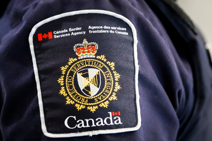 A Canada Border Services Agency patch is seen on an officer in Calgary in 2019.