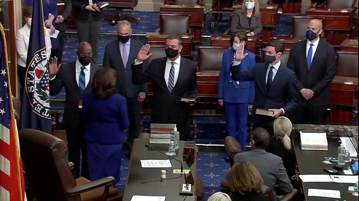 (Left to right) Democrats Raphael Warnock, Alex Padilla and Jon Ossoff take the oath of office administered by Vice President Kamala Harris in the Senate chamber on Wednesday. The three new senators and Harris' role as the Senate's presiding officer established Democrats as the chamber's majority.