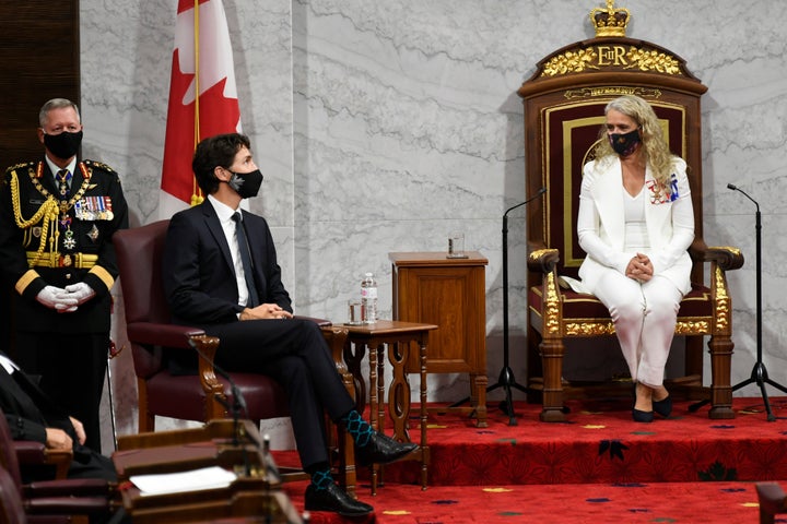 Former Governor General Julie Payette and Prime Minister Justin Trudeau wait during the throne speech in the Senate chamber in Ottawa on Sept. 23, 2020. 