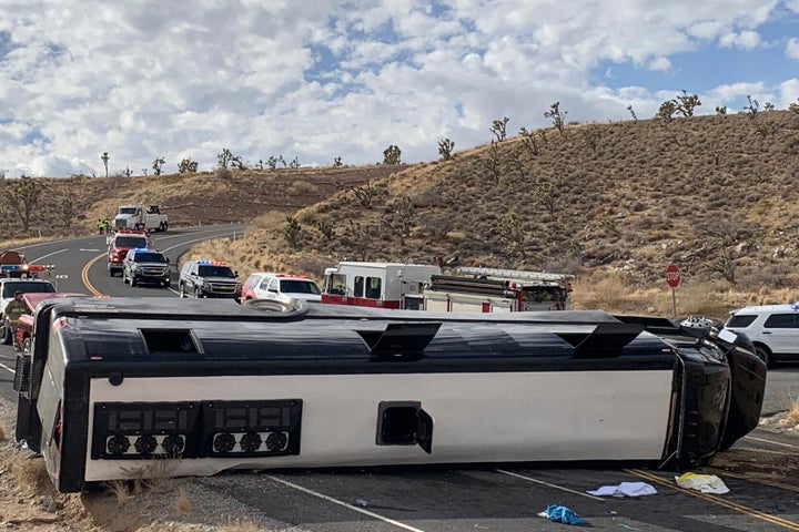This photo provided by the Mohave County Sheriff's Office shows a Las Vegas-based tour that rolled over in northwestern Arizo