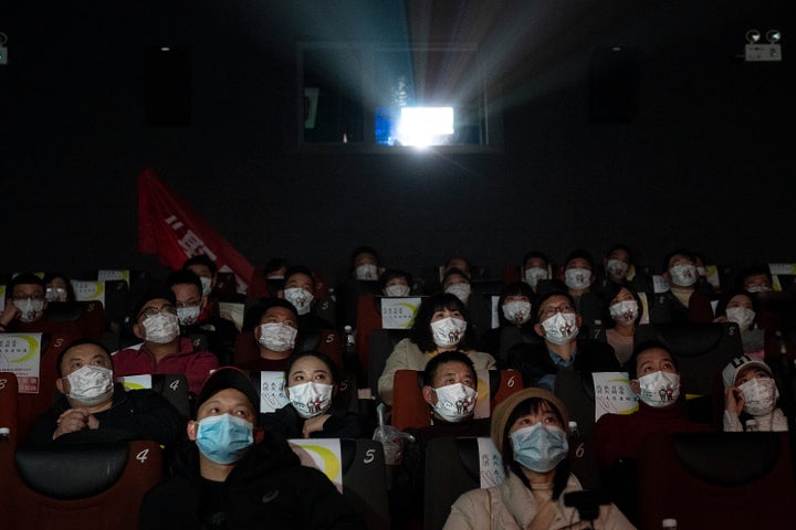 WUHAN, CHINA - JANUARY 23:（CHIHA OUT）Movie goers wear masks while attending the film "Days and Nights in Wuhan" in a cineplex on January 23, 2021 in Wuhan, Hubei Province,China. With no recorded cases of community transmissions since May 2020, life for residents is gradually returning to normal.(Photo by Getty Images)