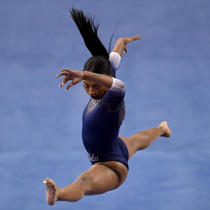 UCLA gymnast Nia Dennis competes in the balance beam against Arizona State on Saturday.