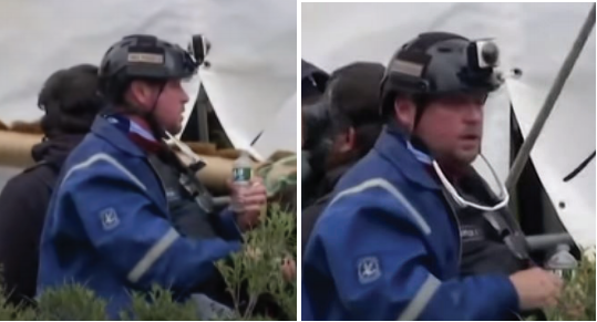 Guy Reffitt, seen wearing a blue jacket and helmet, was filmed appearing to stand behind police lines at the U.S. Capitol dur