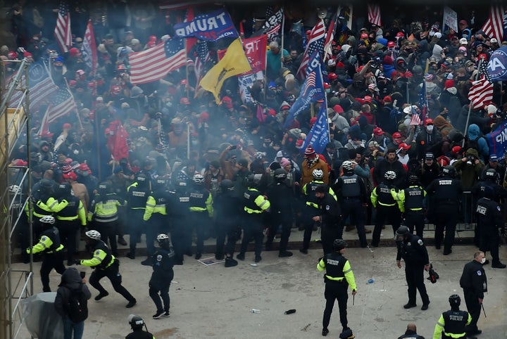 Rioters incited to attack the U.S. Capitol by Donald Trump to disrupt the counting of the electoral college votes clash with police.