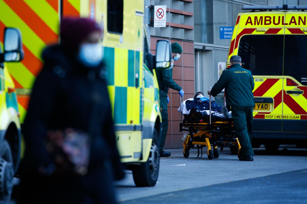 Paramedics wheel a patient into the emergency department of the Royal London Hospital in London.