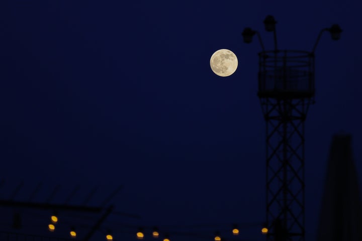 A wolf moon pictured rising over London last January.