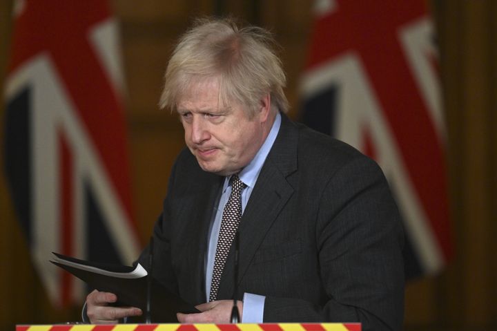 Boris Johnson leaves the podium following a media briefing in Downing Street, London.