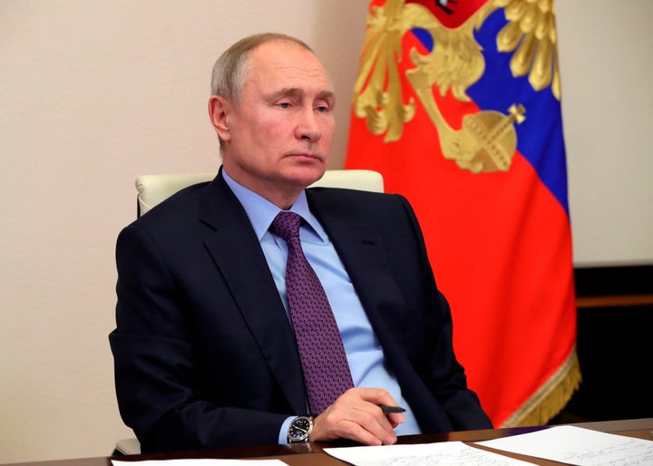 Russian President Vladimir Putin attends a meeting via video conference at the Novo-Ogaryovo residence outside Moscow, Russia