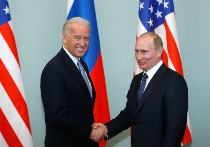 In this March 10, 2011, file photo, then-Vice President of the United States Joe Biden, left, shakes hands with then-Russian Prime Minister Vladimir Putin in Moscow, Russia. (AP Photo/Alexander Zemlianichenko, File)