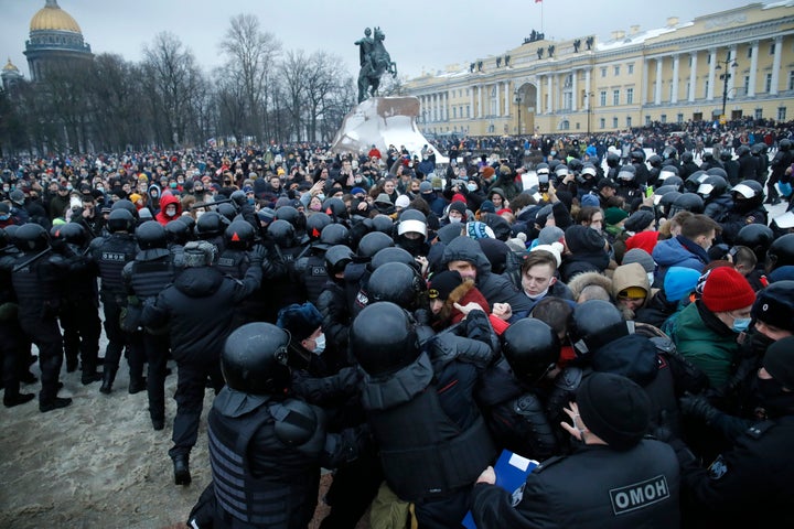 In this Jan. 23, 2021, file photo, people clash with police during a protest against the jailing of opposition leader Alexei