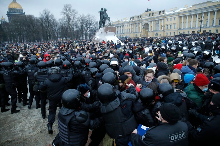 In this Jan. 23, 2021, file photo, people clash with police during a protest against the jailing of opposition leader Alexei Navalny in St. Petersburg, Russia. (AP Photo/Dmitri Lovetsky, File)