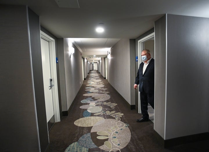 Ontario Premier Doug Ford visits the Holiday Inn Express and Suites, which is used as a COVID-19 isolation hotel during the COVID-19 pandemic in Oshawa, Ont., on Jan. 21, 2021.