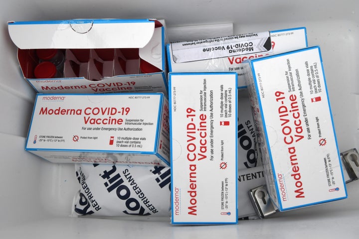Boxes of Moderna COVID-19 vaccine vials are seen in a cooler with dry ice at a vaccination drive-thru site in The Villages, F
