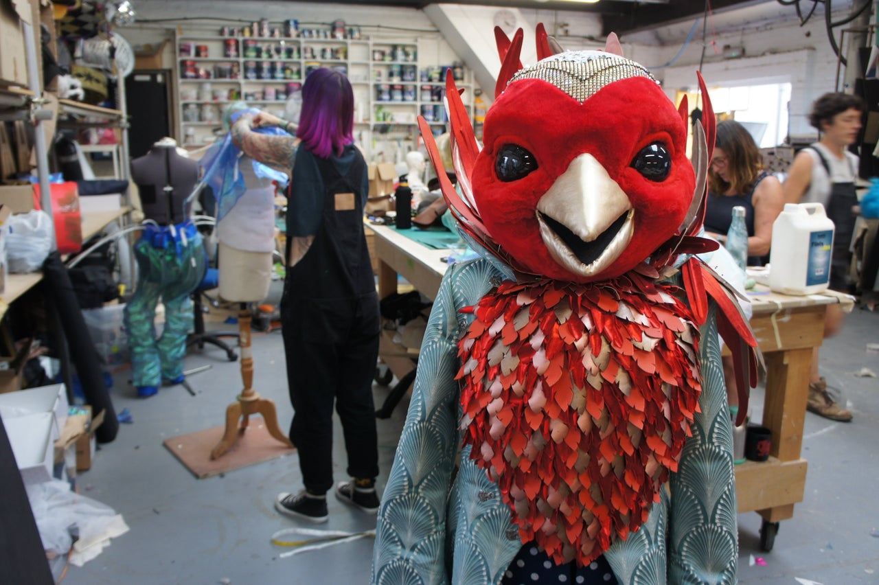 The creative team working on Robin's costume in their workshop