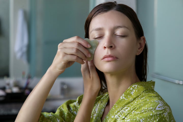 Gua sha facial massage can either be done at home yourself, or professionally at a spa.