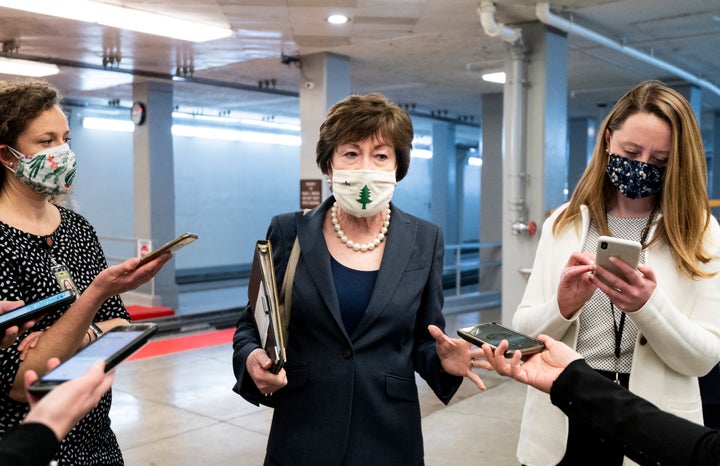 Sen. Susan Collins (R-Maine) speaks with reporters in the Senate subway after a vote in the Capitol on Jan. 26, 2021.&nbsp;