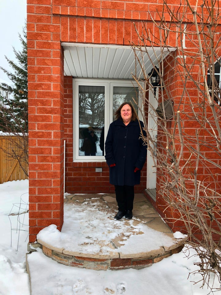 Bonnie Bowering, a supporter of changing her street name from 'Trump Avenue', poses for a photo at her house in a west side suburb in Ottawa on January 26, 2021. 
