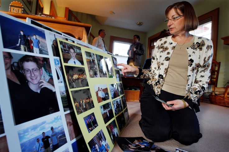 In this Dec. 9, 2011, file photo, Jane Clementi, right, the mother of Tyler Clementi, looks at family photographs in their home in Ridgewood, New Jersey.