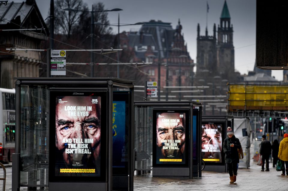 Adverts for the public to adhere to lockdown restrictions in Princess Street, Edinburgh, on January 26