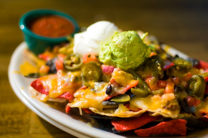 Don't even think about adding guacamole and sour cream before you put the chips in the oven. Those go on afterward.