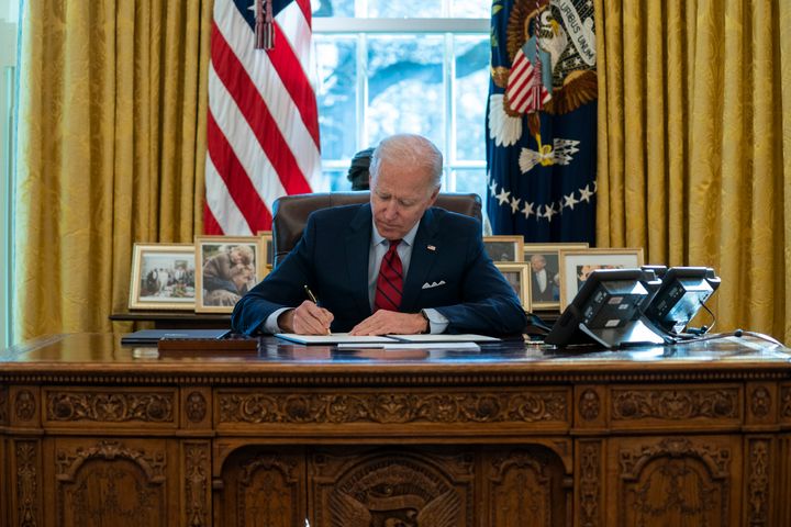 President Joe Biden signs a series of executive orders on health care on Thursday at the White House. The start of his administration has been marked by a series of such orders on a range of issues.
