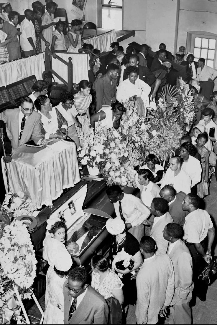 Mourners pass Emmett Till's open casket in Chicago during his funeral in 1955.