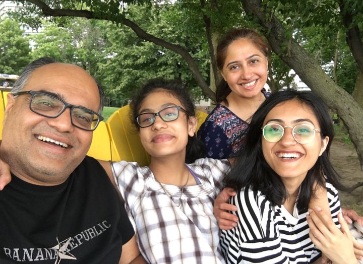 From left to right: the writer, his youngest daughter, his wife, and his eldest daughter.