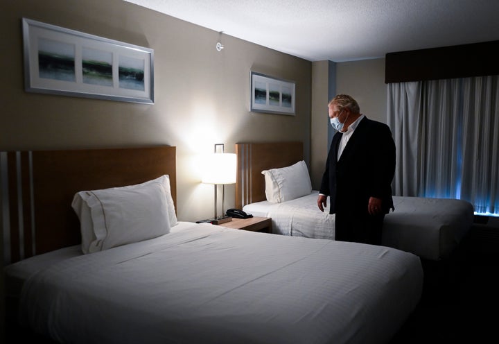 Ontario Premier Doug Ford visits the Holiday Inn Express and Suites, which is used as a COVID-19 isolation hotel during the COVID-19 pandemic in Oshawa, Ont., on Jan. 21, 2021.