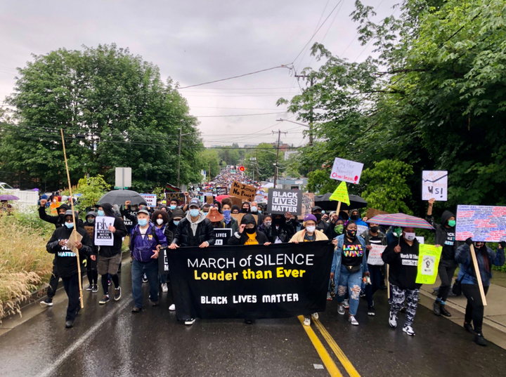 Black youth and Black Lives Matter Seattle-King County lead a silent march of an estimated 60,000 people in June to show supp