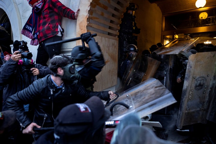 Trump supporters clash with police as they try to storm the Capitol.