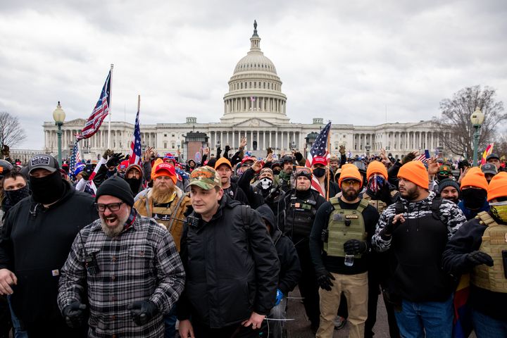 Members of the Proud Boys near the U.S. Capitol on Jan. 6. Joseph Biggs, who posted on Parler that the right-wing gang would be "blending in" with the antifa members he believed would be present, is pictured in gray flannel in the front.