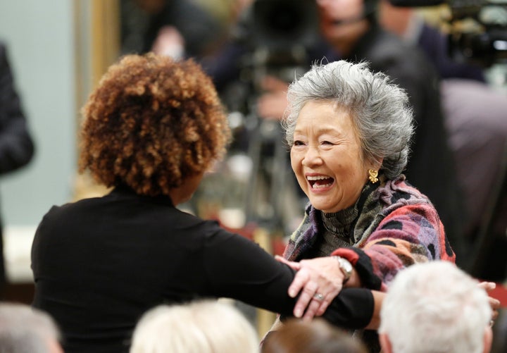 Former Governor Generals Adrienne Clarkson (R) and Michaelle Jean greet each other during a ceremony at Rideau Hall in Ottawa on Nov. 4, 2015.