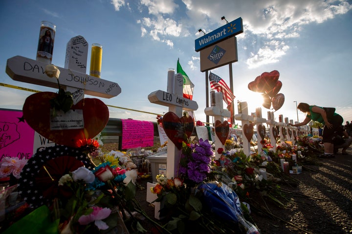 Crosses with names of victims are placed near the Walmart center where a massive shooting took place in El Paso, Texas, on Aug. 5, 2019.