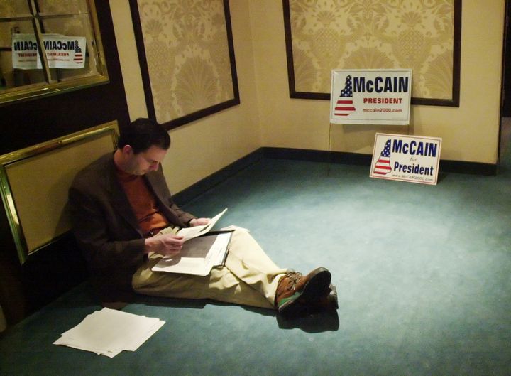 John Weaver, then-adviser to U.S. Sen. John McCain, reads over some papers during McCain's 2000 presidential campaign in New Hampshire on Jan. 27, 2000.