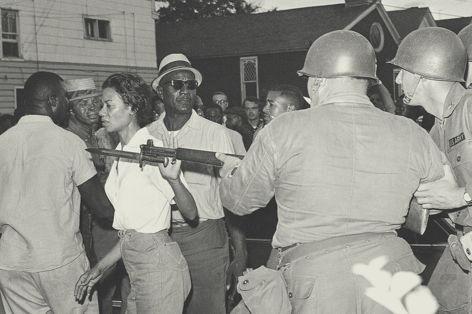 Gloria Richardson, head of the Cambridge Nonviolent Action Committee, pushes a National Guardsman’s bayonet aside in Cambridge, Maryland, on July 21, 1963. The crowd gathered after several Black Americans attempted to enter a street sealed off by troops. Richardson and Fred Jackson (left), a CNAC official, appealed to the crowd to disperse after the Guard threw a tear-gas grenade. <em>AP Photo</em>
