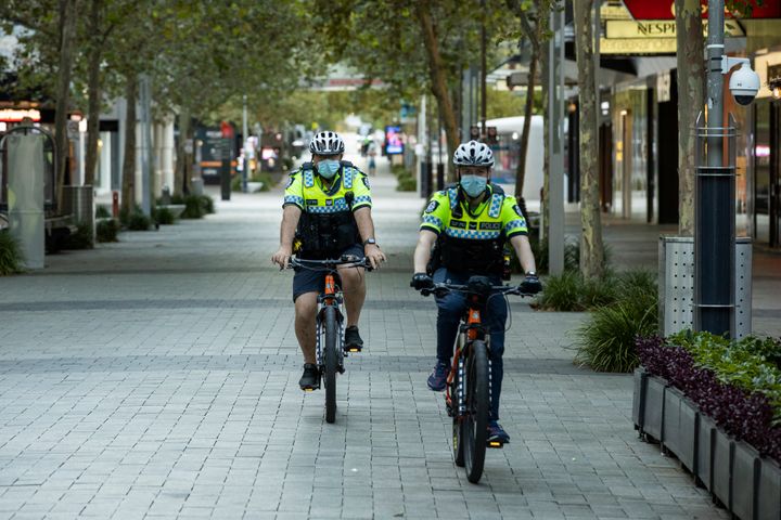 Police are seen patrolling the CDB an hour into the lockdown on January 31, 2021 in Perth, Australia. 