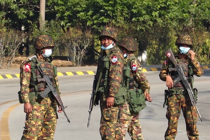 <strong>Soldiers stand guard on a street in Naypyidaw on February 1, 2021, after the military detained the country's de facto leader Aung San Suu Kyi.</strong>
