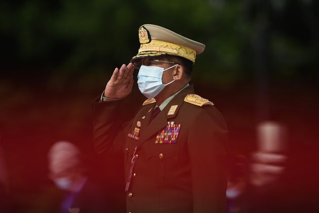 Myanmar's Army Chief Min Aung Hlaing salutes during the 73rd anniversary of the Martyrs' Day ceremony in Yangon on July 19, 2020.