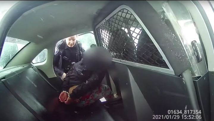The 9-year-old girl was handcuffed and placed in the backseat of a police car. When she apparently refused to put her feet inside the vehicle, the video shows she was pepper-sprayed.