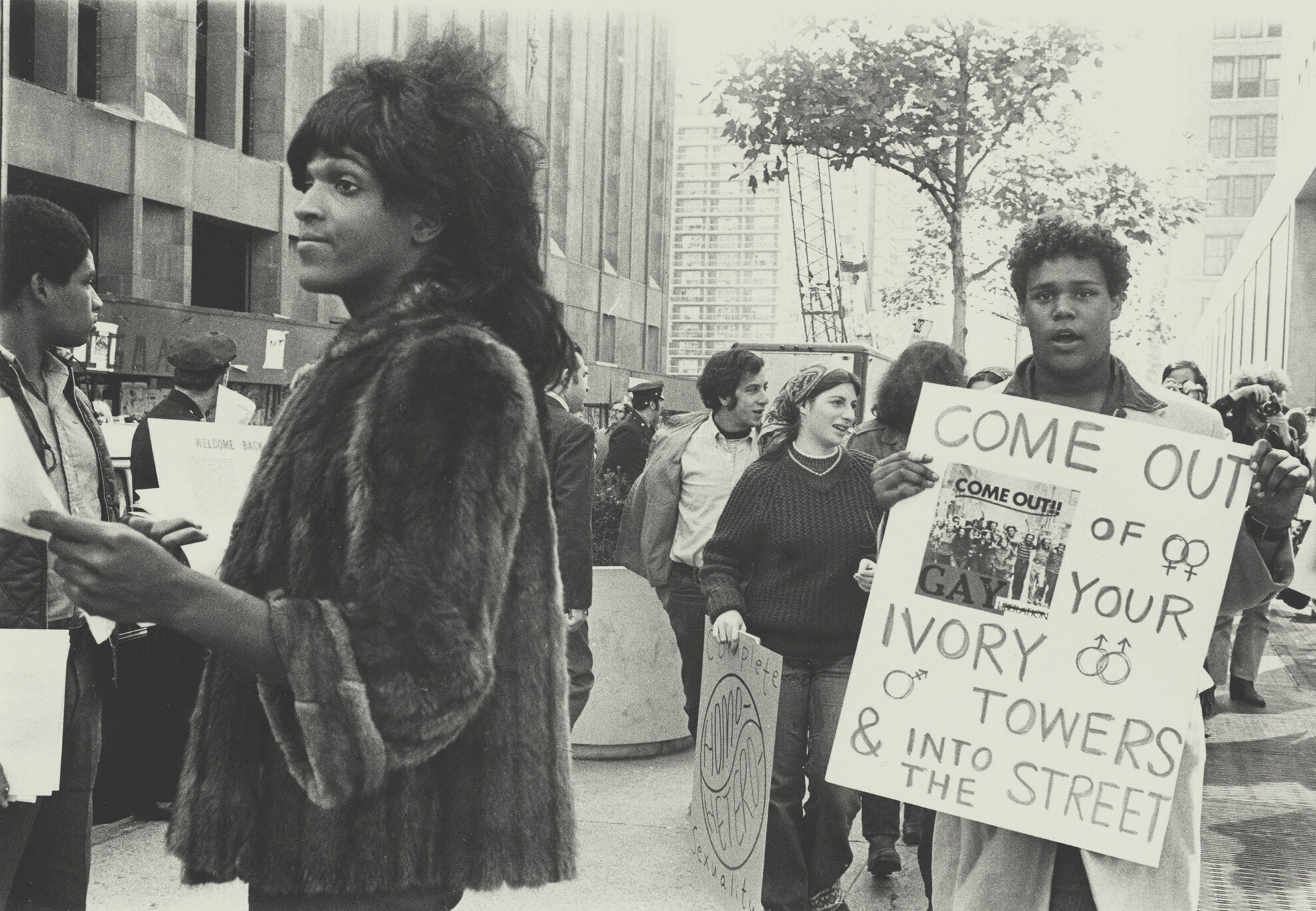 A 1970 photo of Marsha P. Johnson handing out flyers in support of Gay Students at NYU is seen here courtesy of the New York Public Library’s “1969: The Year of Gay Liberation” exhibit. <em>Diana Davies-NYPL/Handout/Reuters</em>