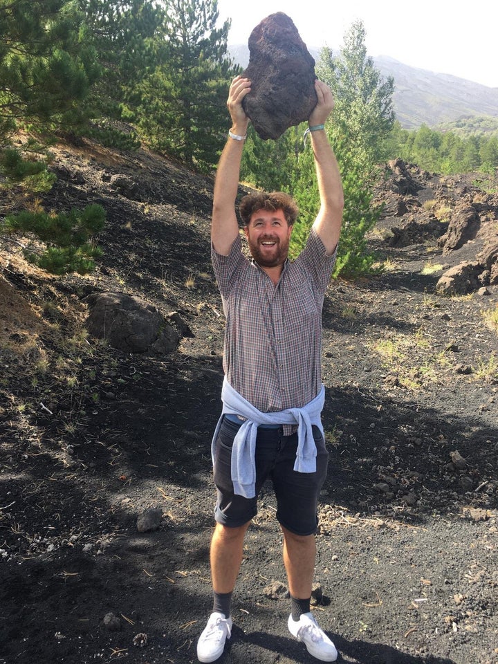 Holding a light volcanic rock 