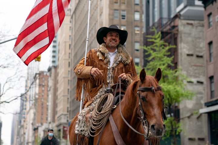 Couy Griffin, who was later charged in connection with the insurrectionist attack on the U.S. Capitol, rides his horse on 5th