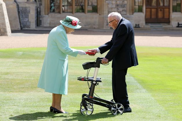 Captain Sir Thomas Moore receiving his knighthood from Queen Elizabeth II during a ceremony at Windsor Castle last year 