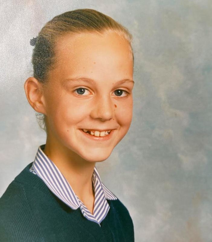 The author at age 11 in a 1988 school photo. "I was expecting the world to end in five years maximum," she says.
