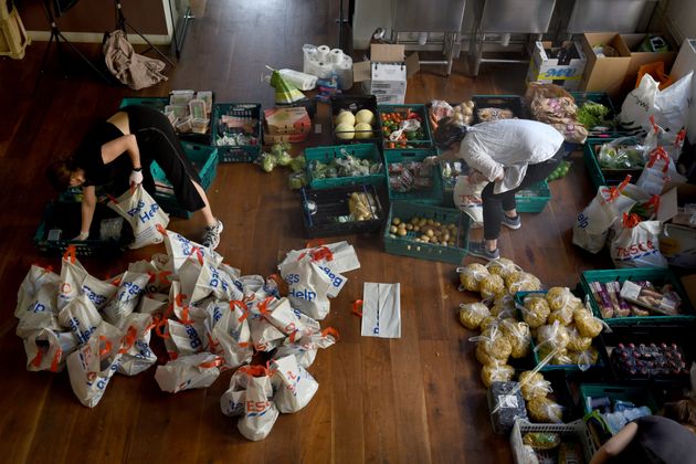 Volunteers from the Islington Covid-19 Mutual Aid group preparing food parcels for a weekly distribution to members of their community who are in self-isolation and experiencing financial difficulties 