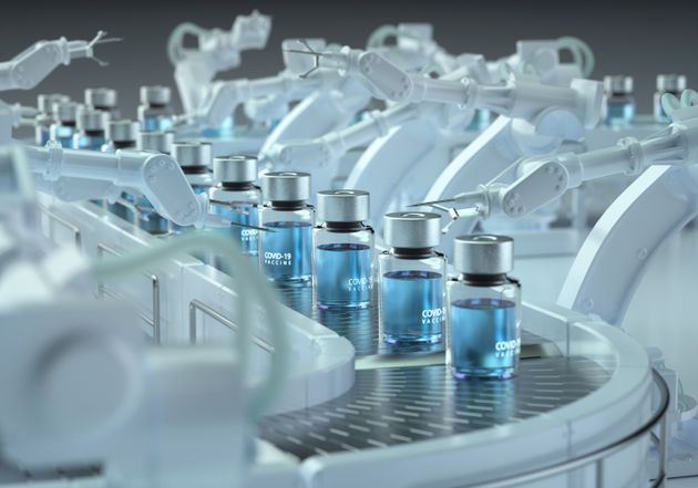 Digital generated image of COVID-19 vaccine bottles standing on robotic production